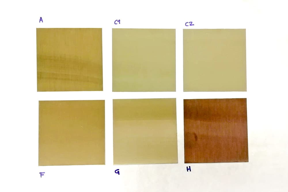 Stainless steel samples showing different levels of yellowing caused by thermal oxidation during high-temperature testing