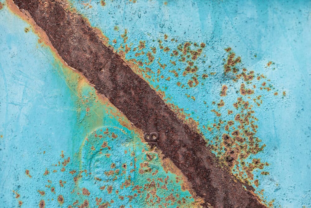 Corrosion crack on metal surface with degraded protective coating