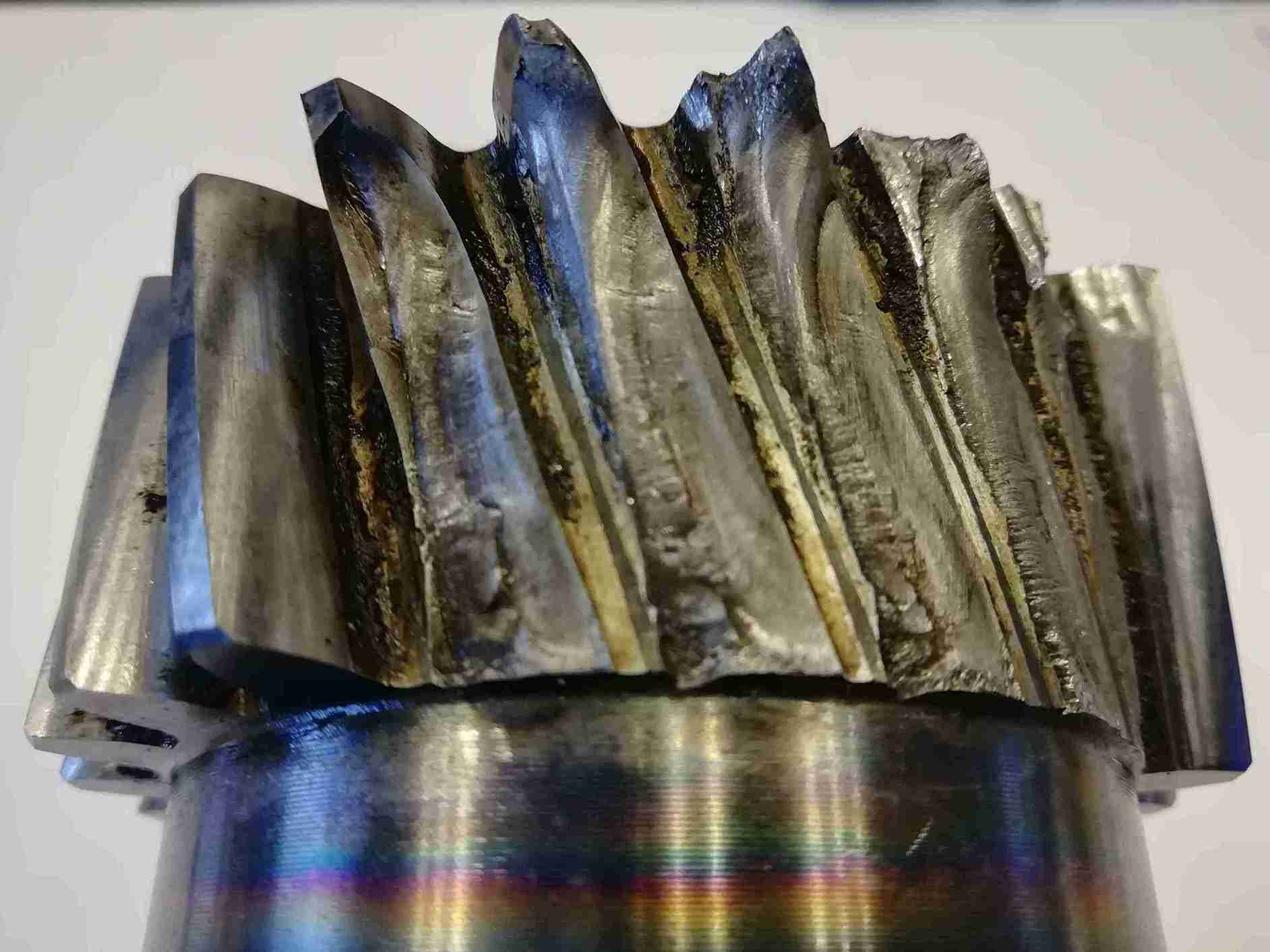 Detail of fatigue fracture on gear tooth with crack propagation marks