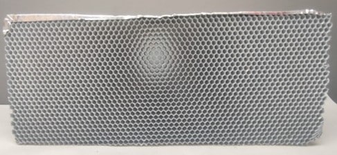 Structured module used in industrial odor removal technologies for the treatment of emissions containing volatile organic compounds (VOCs)