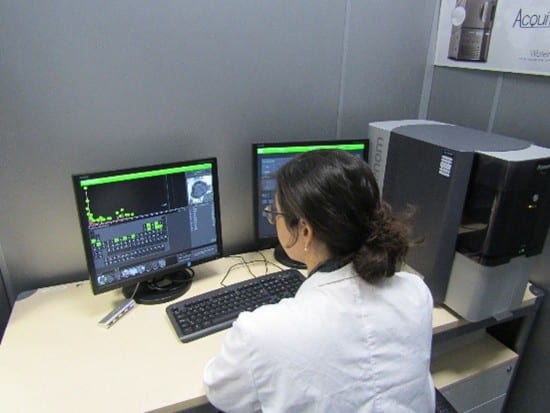 Engineer analyzing scanning electron microscopy (SEM) results to evaluate the corrosion resistance of electronic components