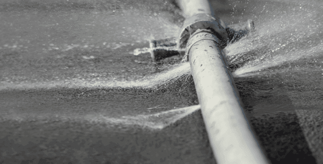 Rupture in an industrial pipe caused by wear or premature failure under service conditions