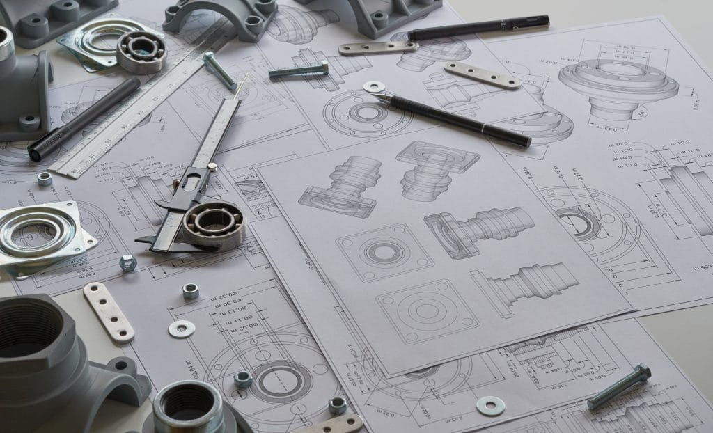 Planos técnicos con piezas mecánicas metálicas y calibre para desarrollo mecánico de producto
