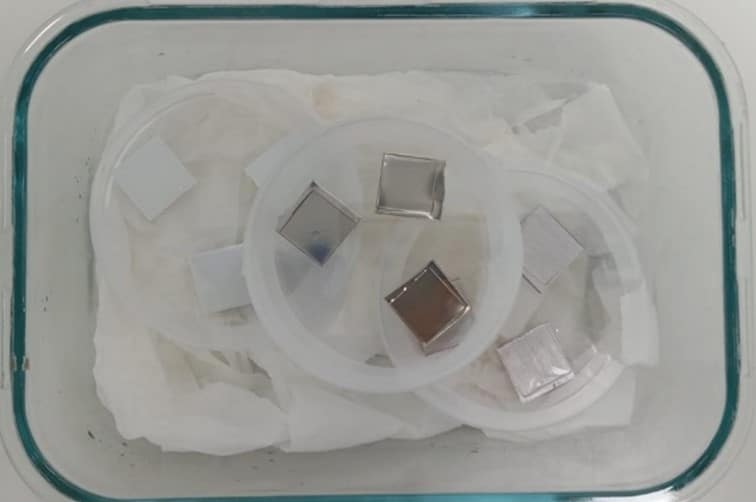 Accelerated testing and material homologation to ensure antimicrobial activity in demanding environments Material samples undergoing microbiological testing to evaluate antimicrobial activity during a material homologation process