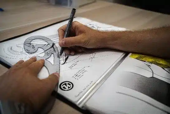 Hand drawing product design sketches on paper