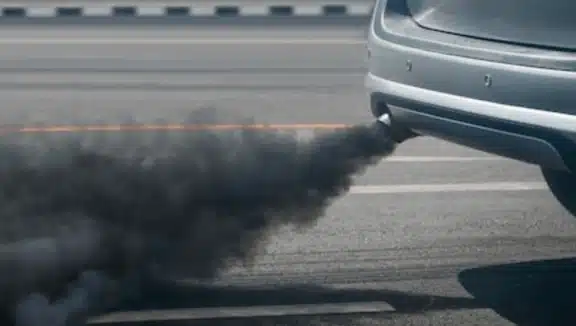 Black smoke coming out of a vehicle exhaust pipe