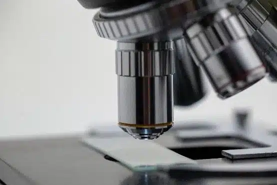 Redesign of the graphic image to reflect corporate identity Optical microscope focusing on a sample